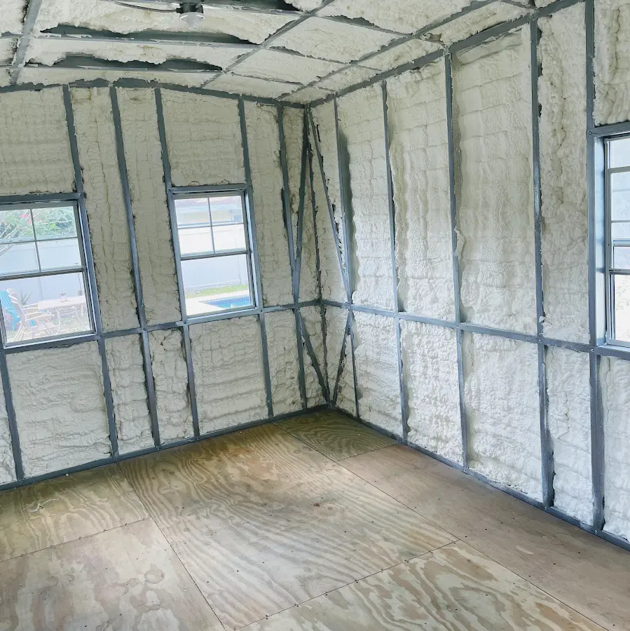 Closed-cell spray foam insulation applied to wall cavities in a residential project in Hudson